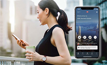 Woman accessing HSBC Business Express application on her mobile phone Woman accessing HSBC Business Express application on her mobile phone