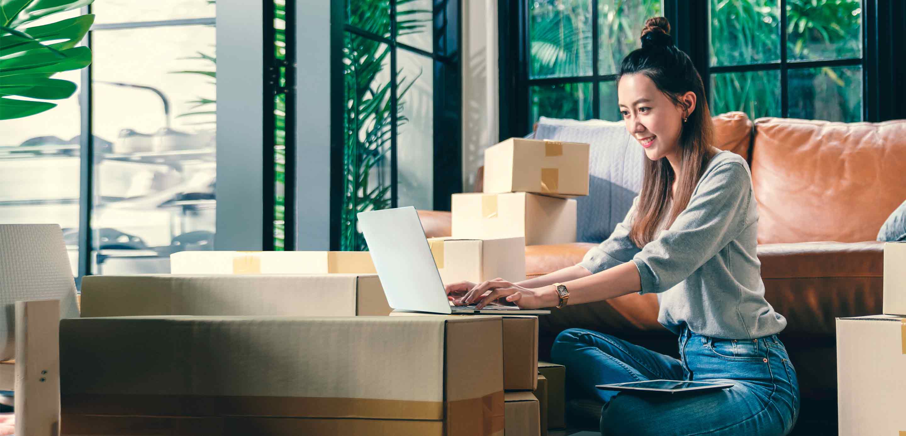 A lady is working on laptop for trade transactions at workplace A lady is working on laptop for trade transactions at workplace